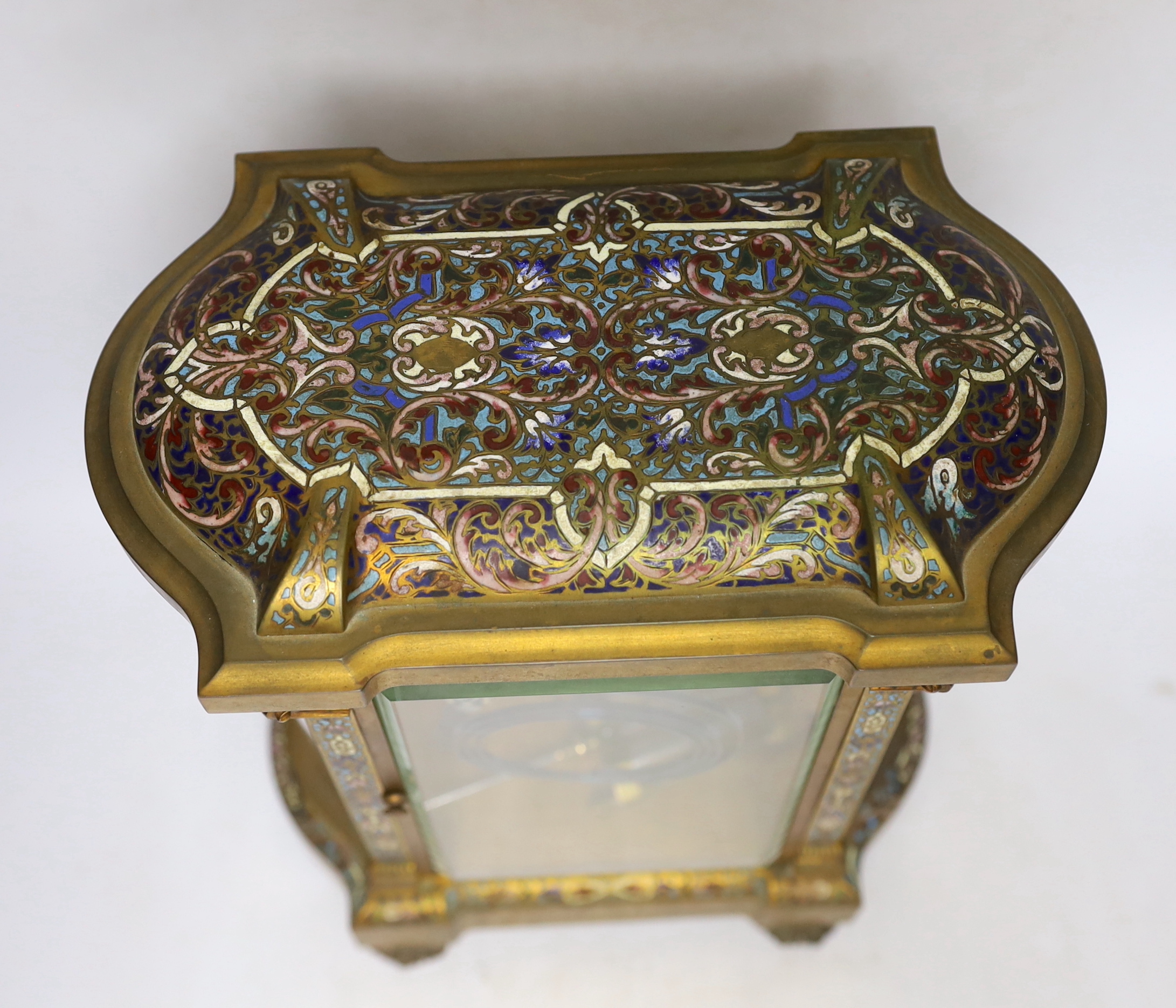 A late 19th century French gilt brass and champleve enamel cased eight day four glass mantel clock, 34cm high